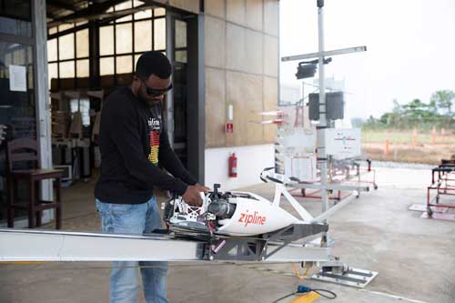  A flight operator at Zipline in Ghana packs a drone with medical supplies for delivery. Zipline delivers medical products using drones. Credit: Gavi/2022/Nipah Dennis 