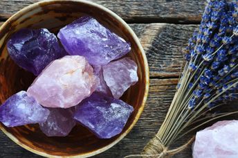 Pottery bowl with large rose quartz and amethyst crystals.