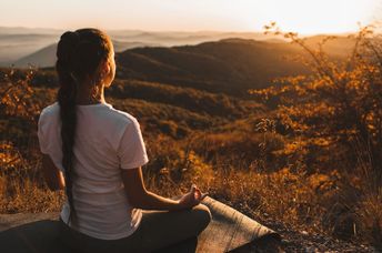 Woman meditating in nature.