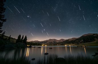 Meteor shower in the night sky.