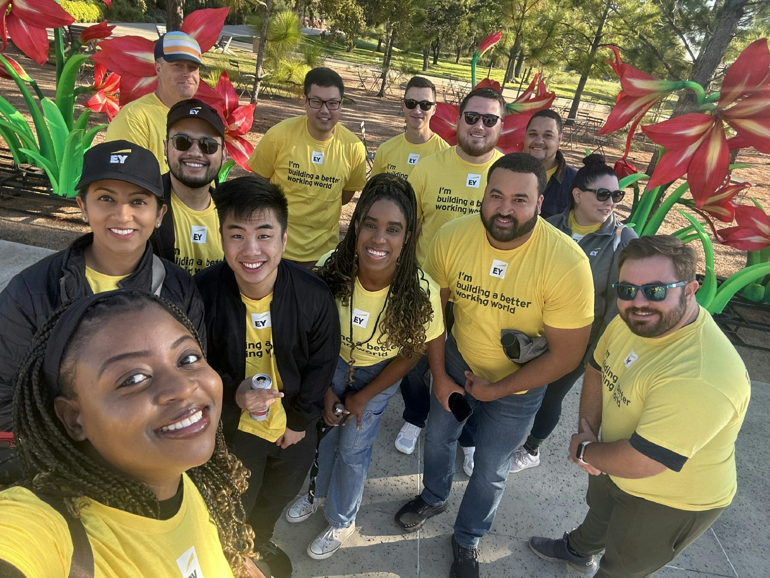 EY Connect Day participants show their love for volunteering at the Houston Botanic Garden. 