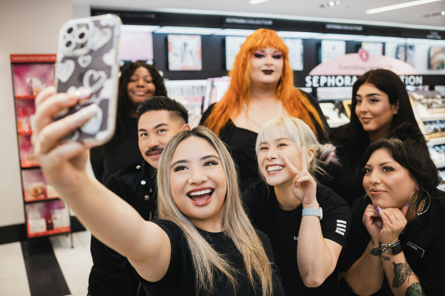 Employees taking a selfie at a Sephora store.