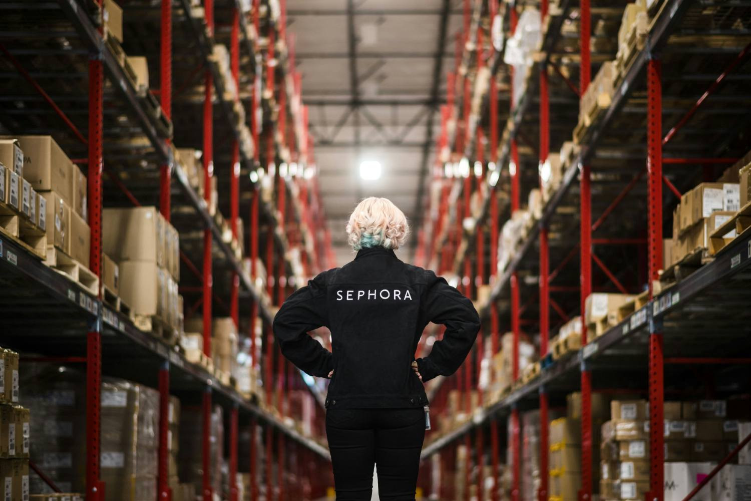 Employee standing at one of Sephora's distribution centers.