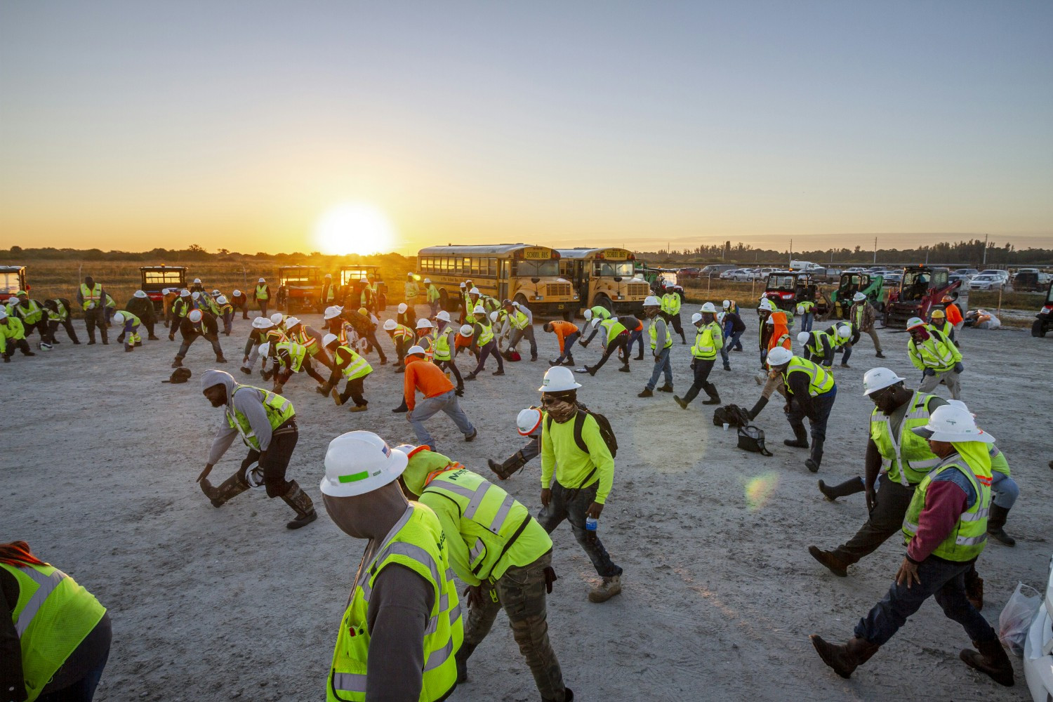 Workers doing their daily stretch and flex to start the day off.