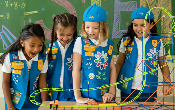 Four Daisy Girl Scouts watching S.T.E.M. designed Coaster in use