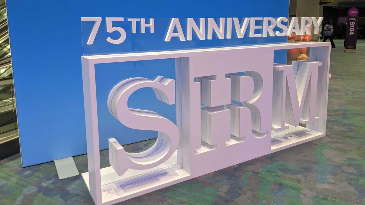 Conference hall signage that says "75th Anniversary SHRM"