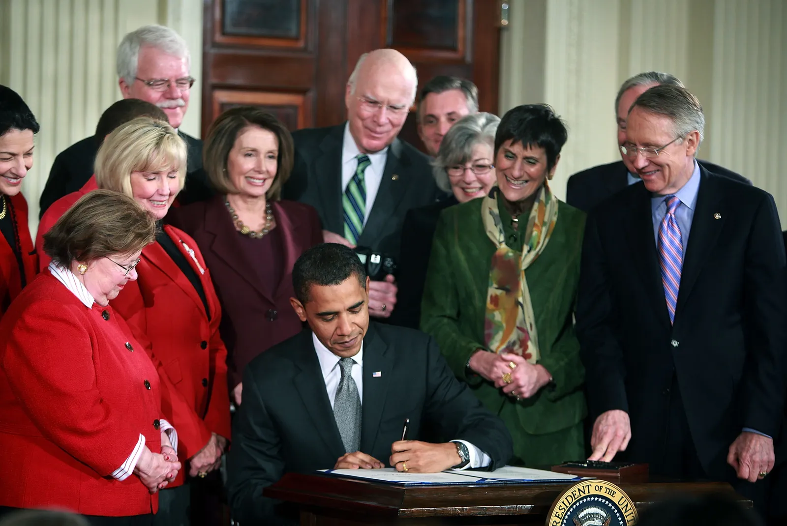 Surrounded by members of Congress, U.S. President Barack Obama signs the &quot;Lilly Ledbetter Fair Pay Act in the East Room of the White House on Jan. 29, 2009 in Washington, DC.