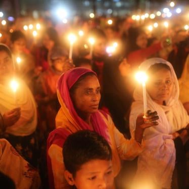 A crowd of women holding candles