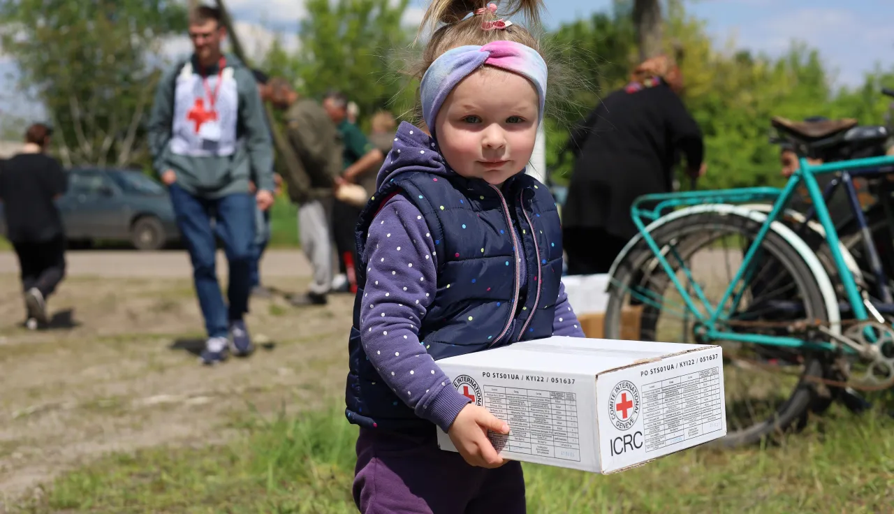 Distributing food supplies and hygiene kits.