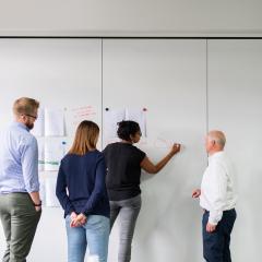 Image of students writing on whiteboard. Image courtesy of RAEng_Publications pixabay