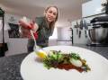 Figtree chef Brooke Silk plates up a dish. Picture by Adam McLean