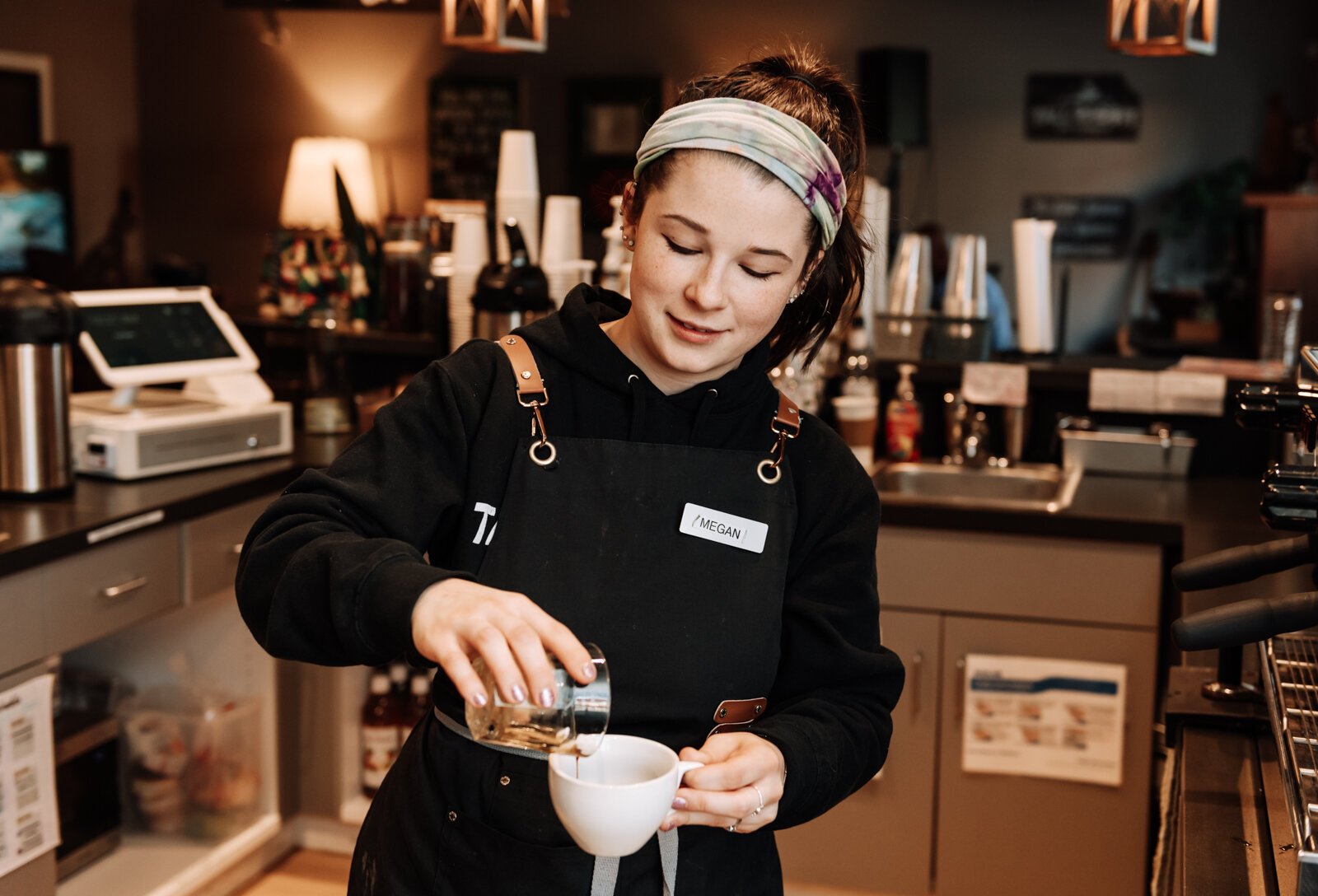 Cafe Manager Megan Spring makes a "Special Cappuccino Drink" at Tall Rabbit.