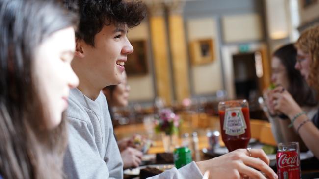 Students chatting in Caff