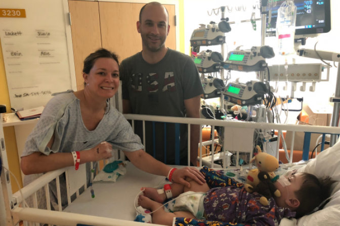 Baby Lockett in a hospital bed after receiving a kidney transplant from his mom