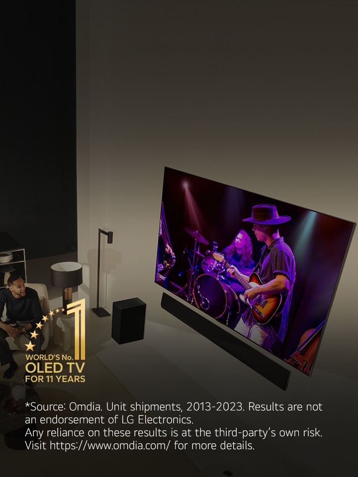 An aerial view of a man and woman watching a concert on a large OLED TV in a modern apartment. The "World's No. 1 OLED TV for 11 Years" emblem is in the image. A disclaimer reads: "Source: Omdia. Unit shipments, 2013-2023. Results are not an endorsement of LG Electronics. Any reliance on these results is at the third-party’s own risk. Visit https://www.omdia.com/ for more details."