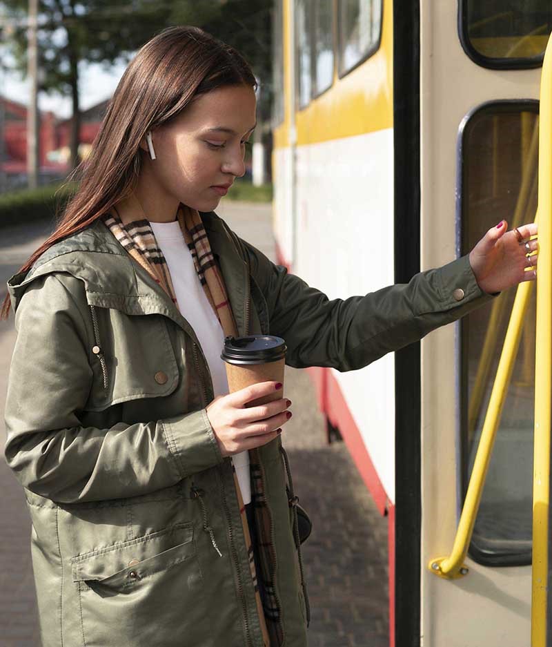 girl getting on bus