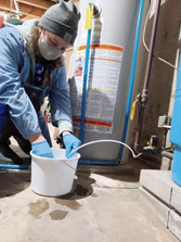 DEP Staff sampling water after treatment