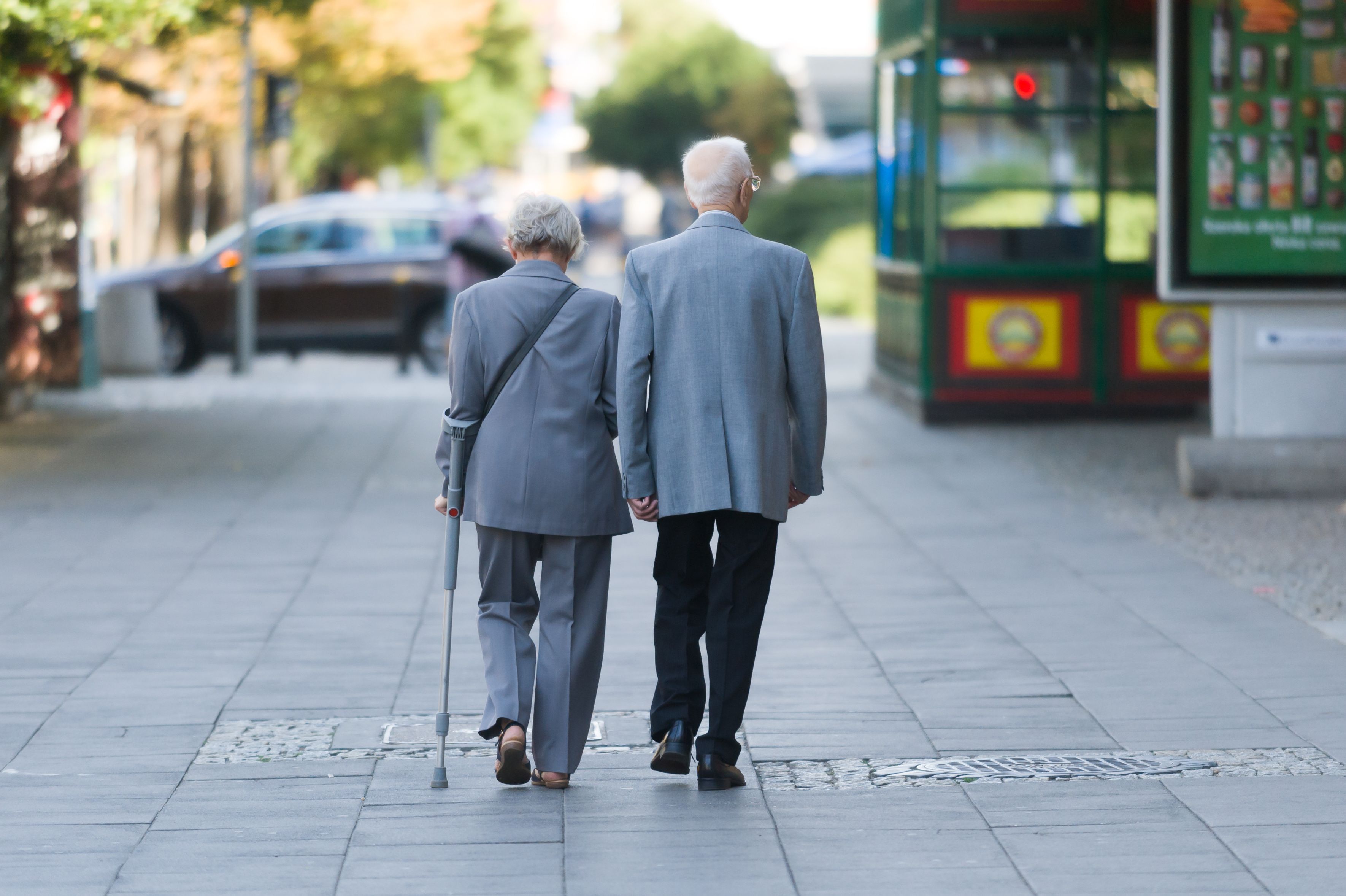 Older couple walking on sidewalk | Image credit: ©Fotowawa stock.adobe.com