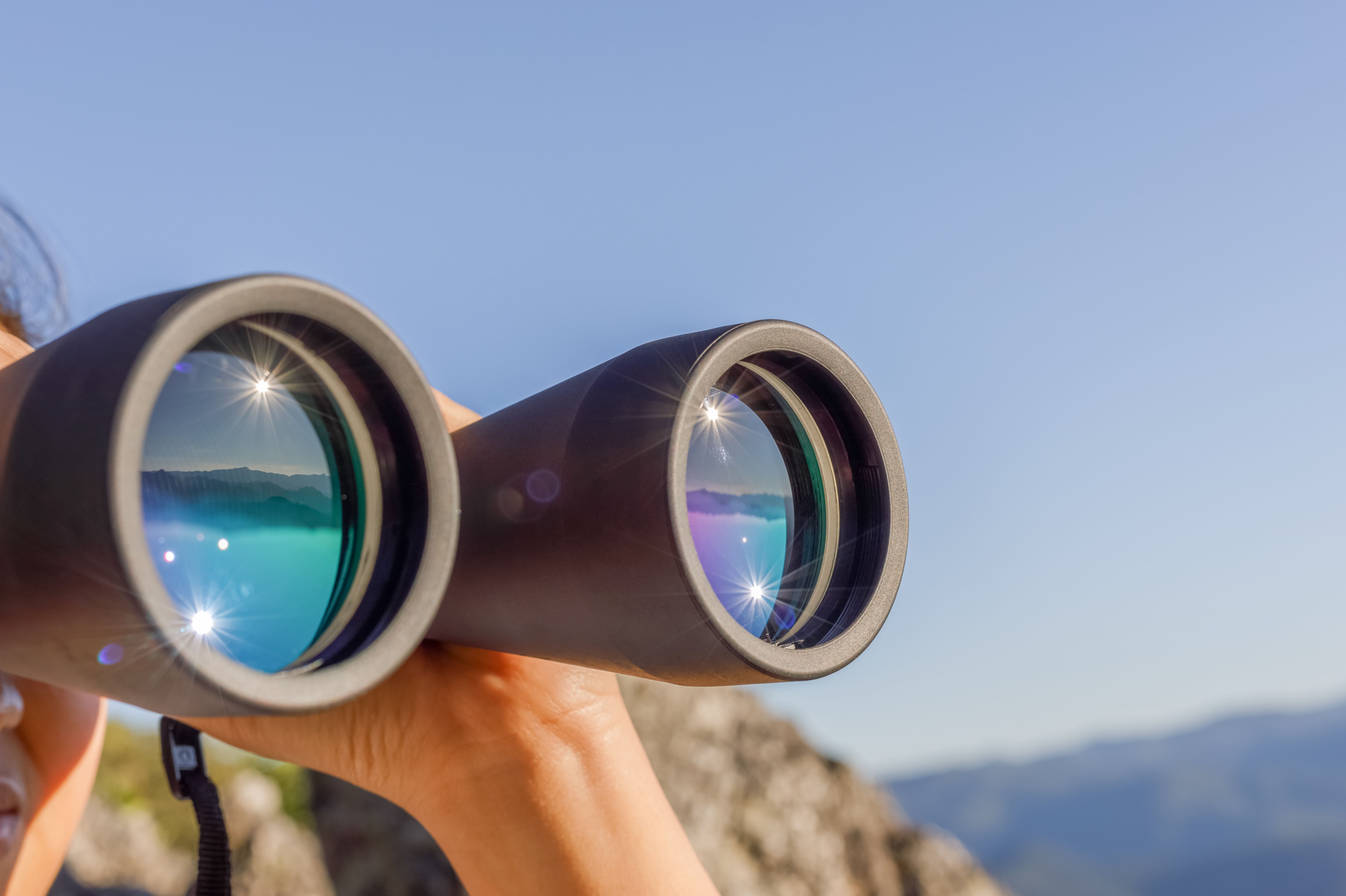 person looking through binoculars | Image credit: ©Aungmyo  stock.adobe.com