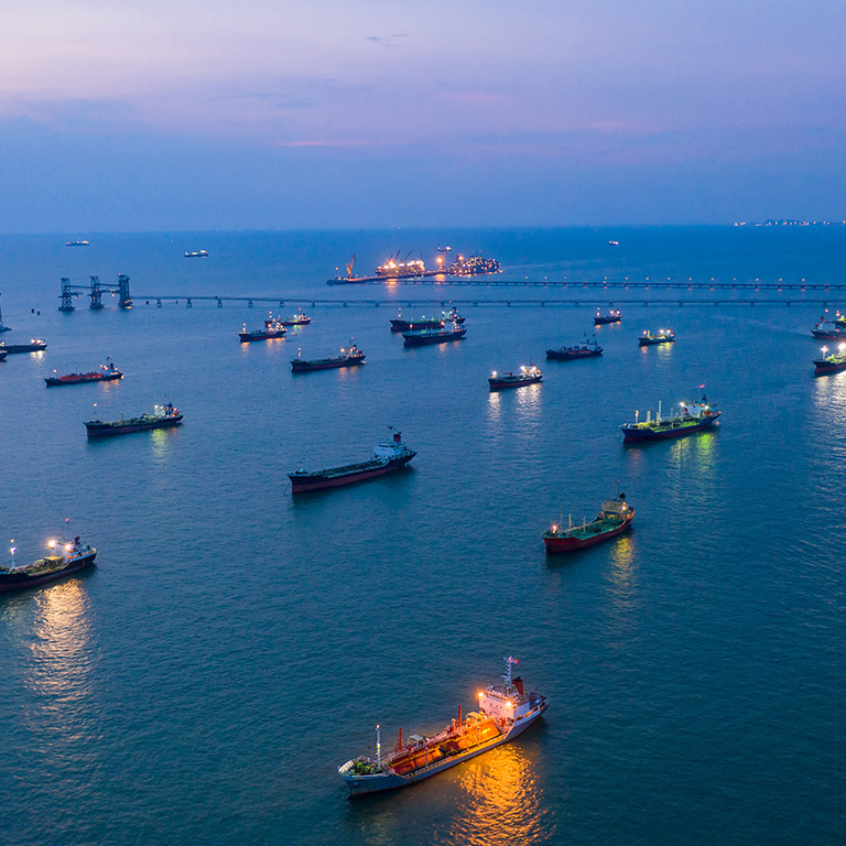 Aerial view tanker offshore in open sea at night, Refinery industry cargo ship, Oil product tanker and LPG tanker at sea view from above, Aerial view oil tanker ship vessel.