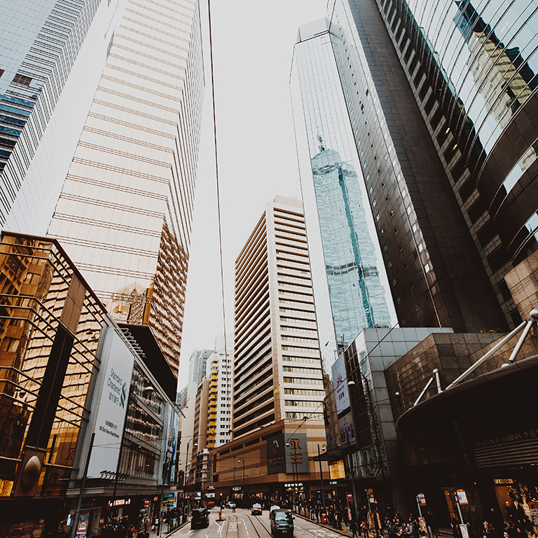 Low Angle View Of Modern Buildings In City Against Clear Sky