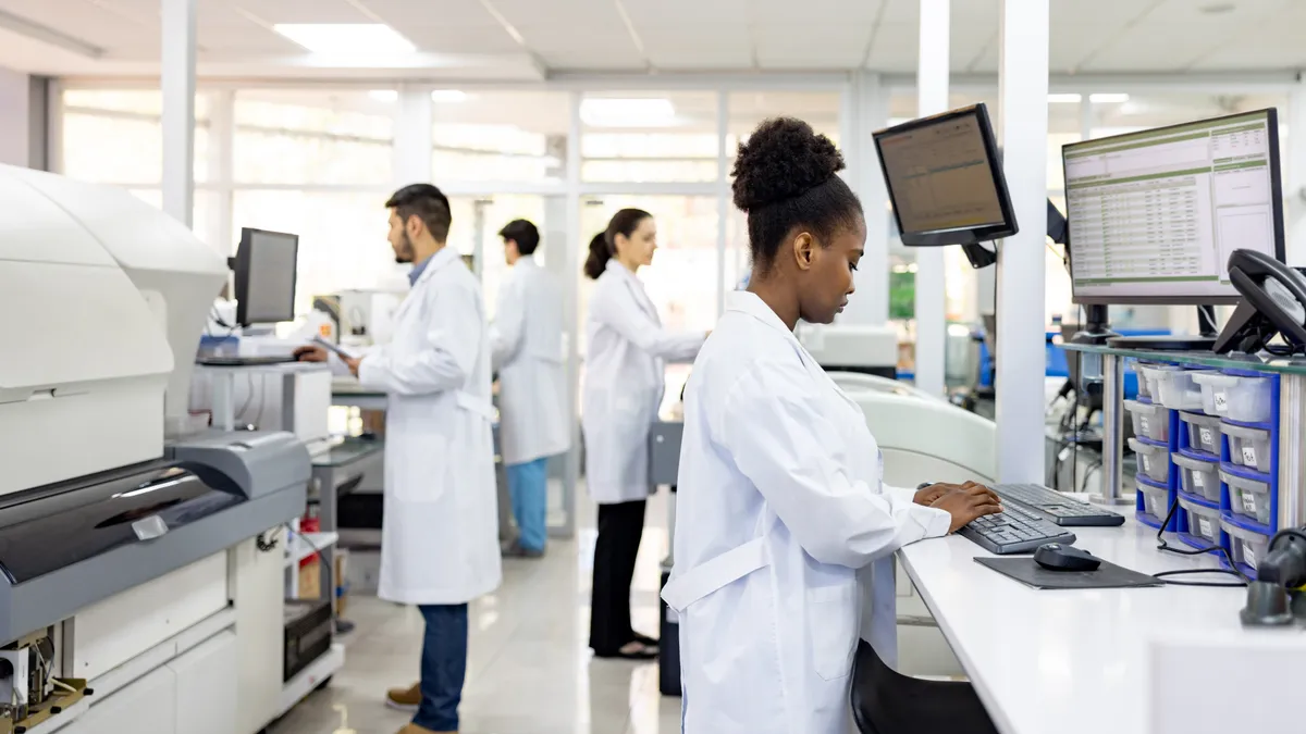 Multiracial group of scientists working at the laboratory researching