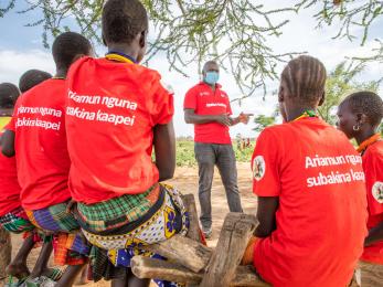 Mercy corps’ karamoja south team leader for the apolou program, speaks to girls participating in a safe space program.