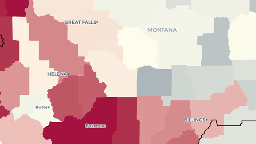 A close-up of a map of Montana that shows counties filled in solid shades of blue and red that represent their average home values. Place names for the state of Montana and several of its largest cities are overlaid on the map.