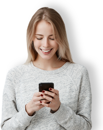 Woman smiling down at mobile phone