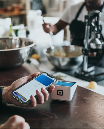 customer using contactless payment at a point of sale system