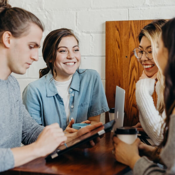 friends around table on tablet