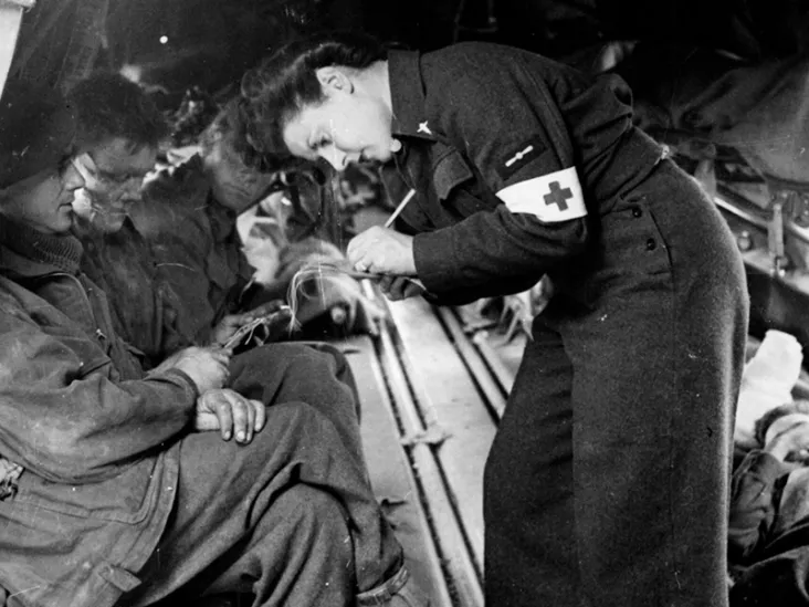 Leading Aircraftwoman Pearl Bradburn recording details of casualties before take-off from Bazenville, Normandy, 1944