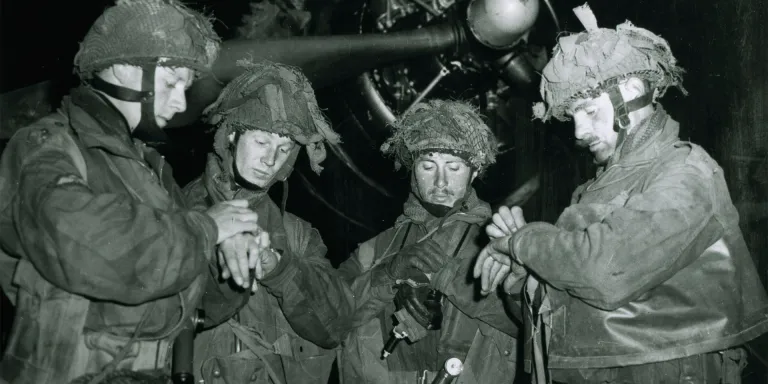 Airborne Forces synchronising their watches before the invasion