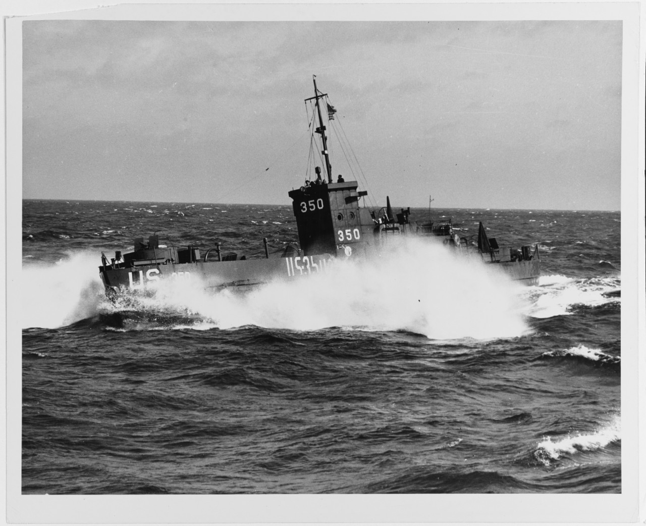 A US Coast Guard Landing Craft Infantry (LCI) struggles to make way in a swirling sea