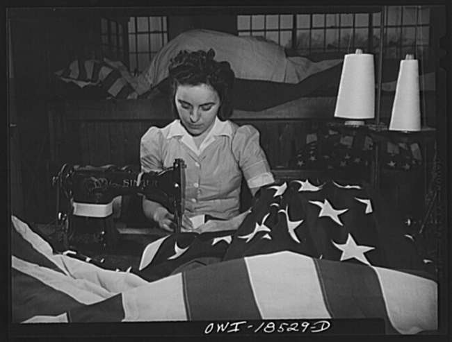 Sewing the edge of an American flag at the Annin Flag Company