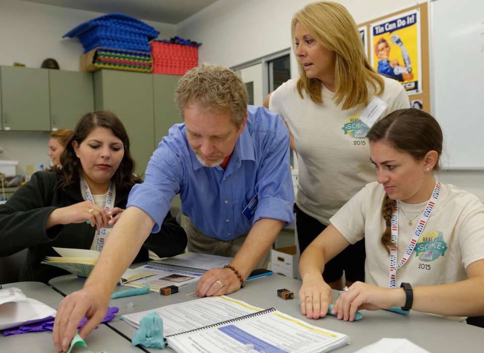 Teachers using classroom materials