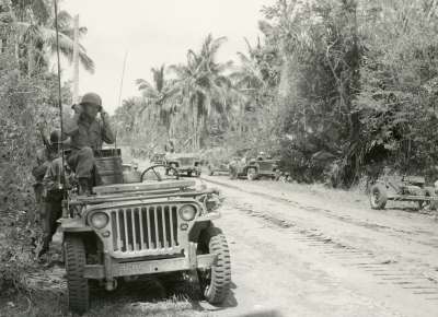 Soldier with radio in Jeep, Pacific theater