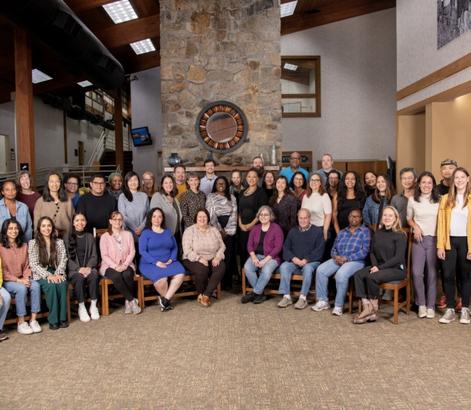 A group of fifty NELP Staff pose for a group portrait in 2023.