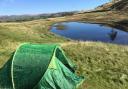 The abandoned tent with School Knott tarn in the background