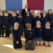 Chris Holmes DL, the high sheriff of Cumbria, with pupils at Brook Street Primary School in Carlisle.