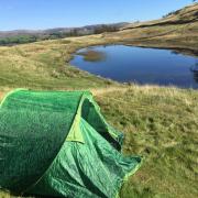 The abandoned tent with School Knott tarn in the background