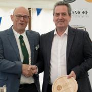 Customer quality manager, Jack Eade (R), receiving one of First Milk’s two trophies from Frome & Agricultural Cheese Show president, Michael Rogers (L)