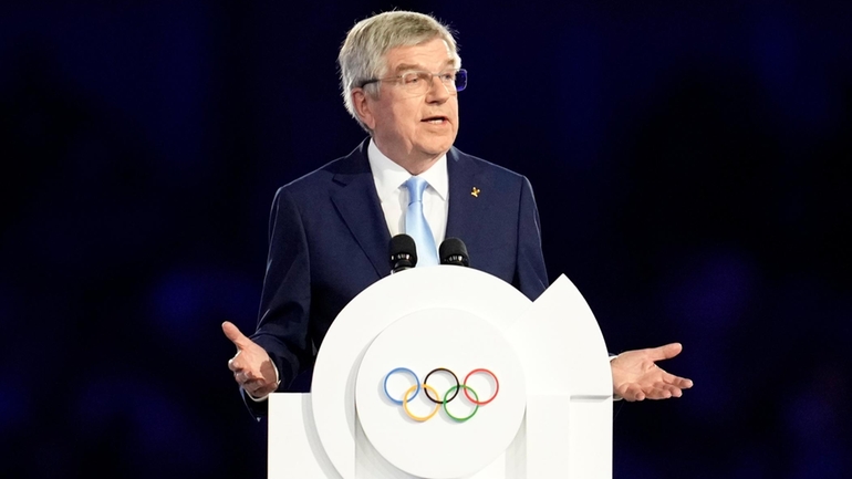 IOC President Thomas Bach addresses the audience during the 2024...