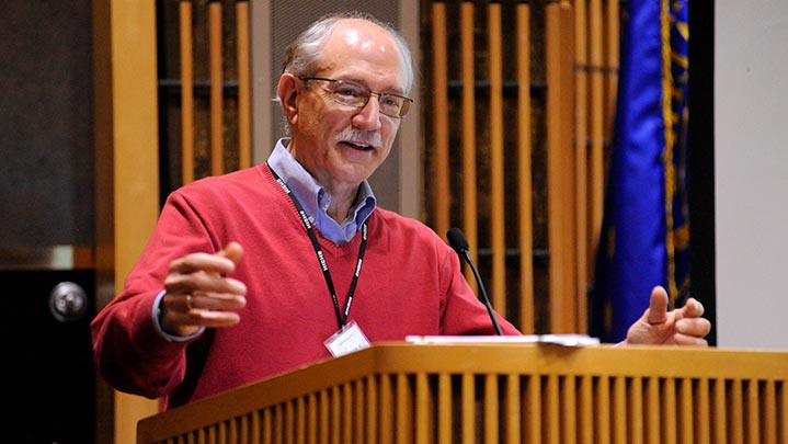 the niehs director speaking at a podium