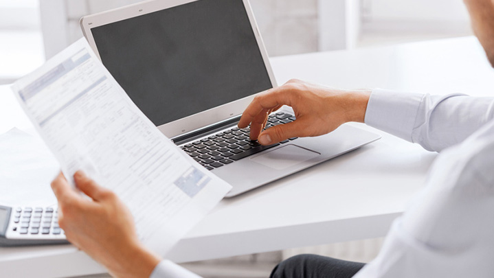 Man typing on computer