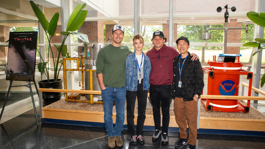 NOAA National Severe Storms Laboratory research scientist Sean Waugh (third from right) poses with (L to R) producer Ashley Jay Sandberg, Daisy Edgar-Jones, director Lee Isaac Chung, Glen Powell and Anthony Ramos in front of a NOAA weather instrument display at the Oklahoma City premiere of Twisters on July 15, 2024.