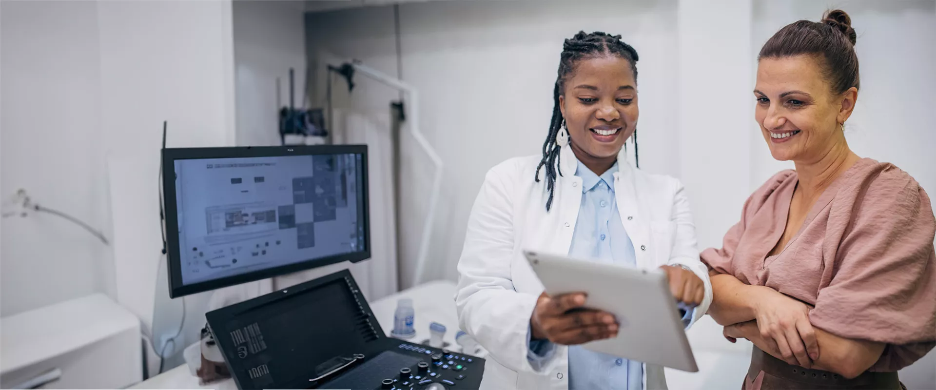 Doctor and patient discussing medical results on an iPad