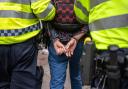 A file image of a man being arrested