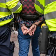 A file image of a man being arrested