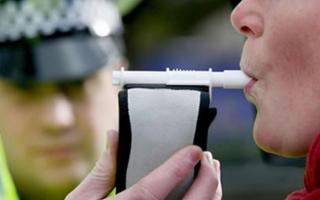 A stock image of a person being breathalysed by police